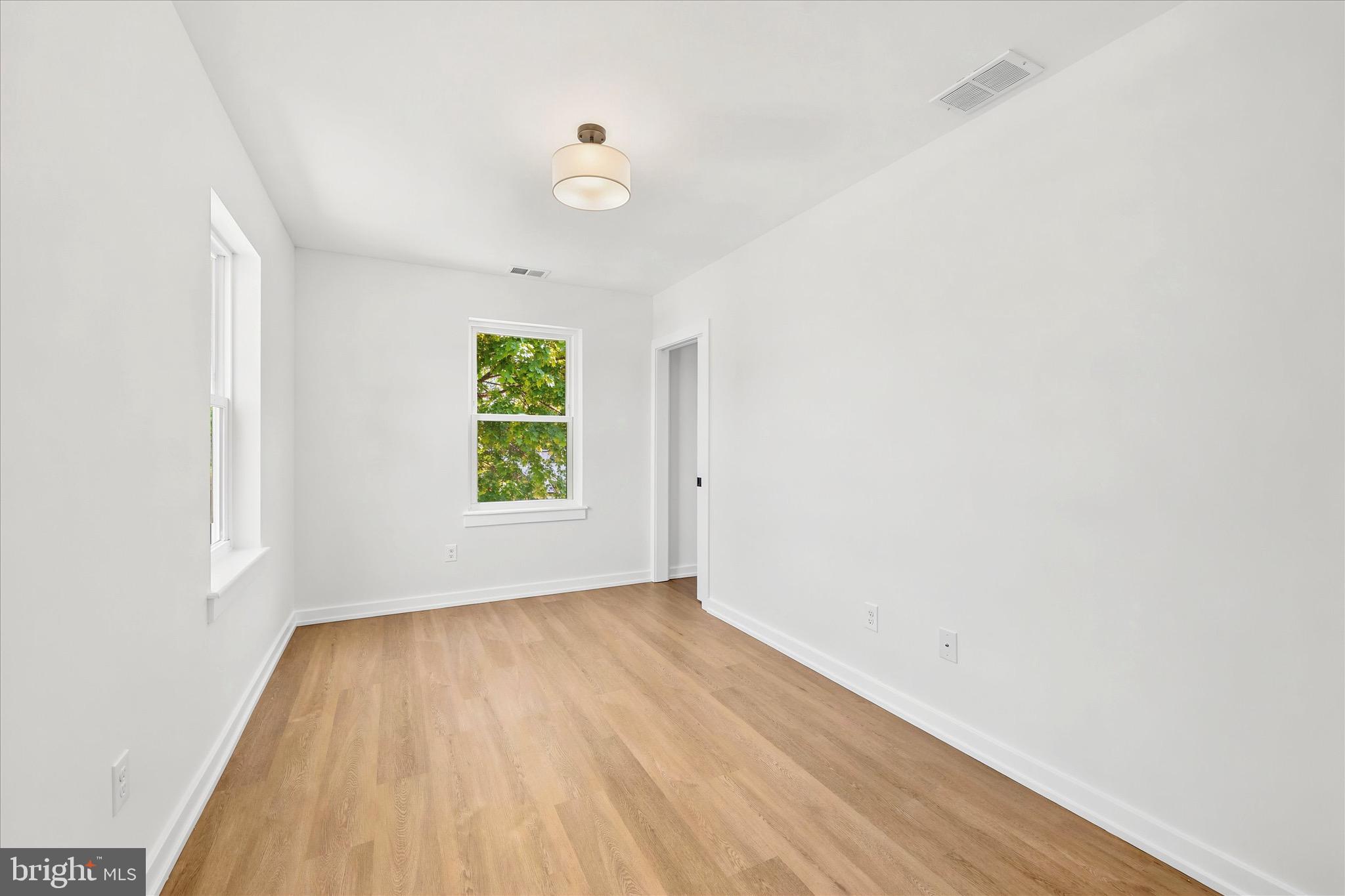8 James Road Broomall, PA 19008 - Photo 29 of 35 an empty room with wooden floor and windows