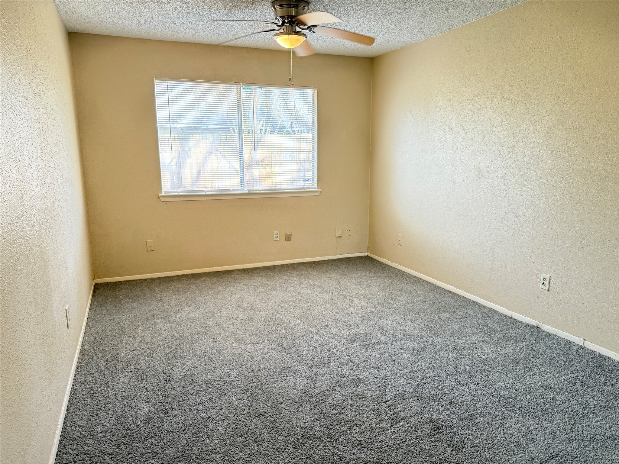 3219 Forestbrook Drive Spring, TX 77373 - Photo 9 of 16 Primary bedroom features neutral walls, ceiling fan, bright and cozy space.