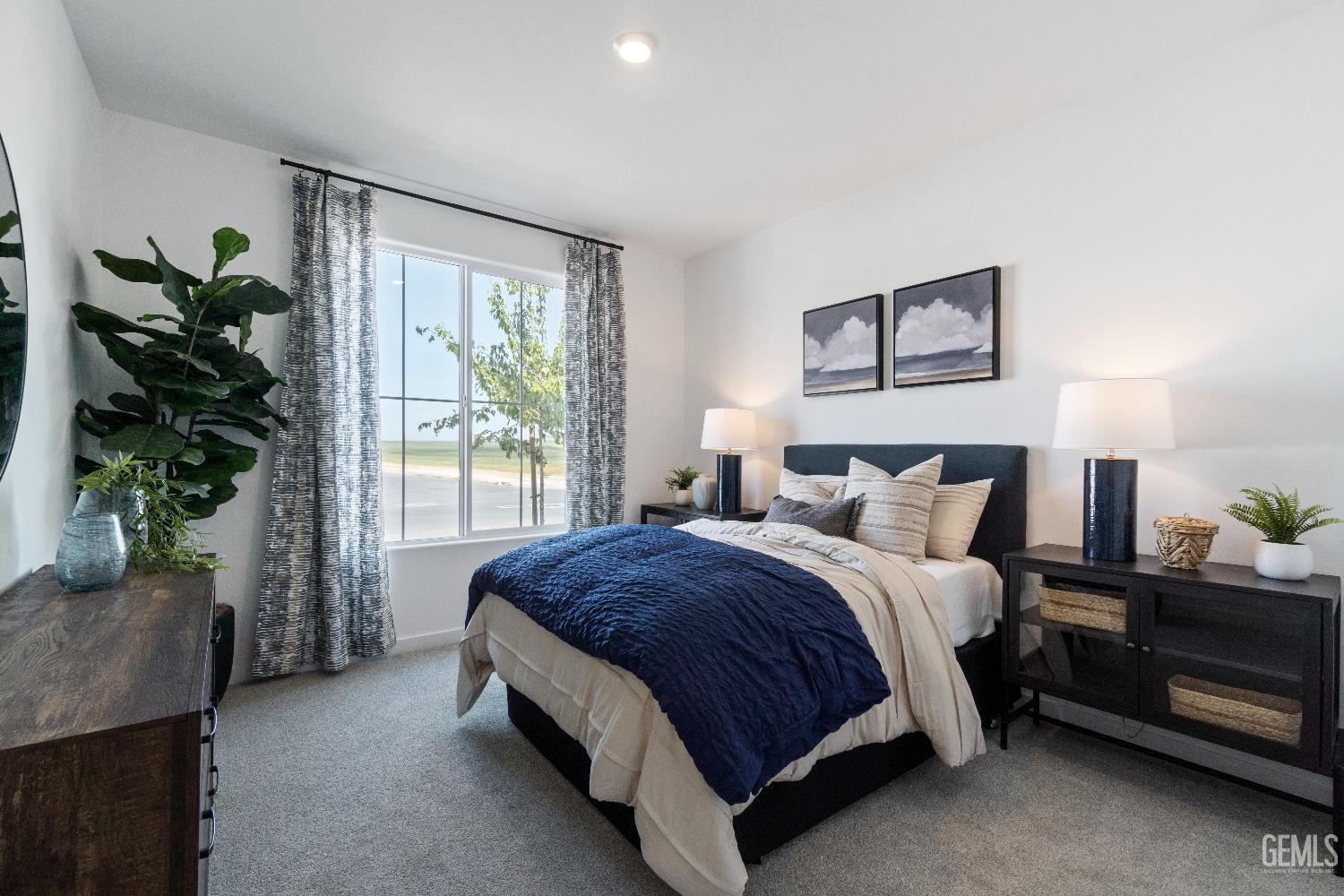 Undisclosed Address Shafter, CA 93263 - Photo 17 of 21 a spacious bedroom with a bed and a potted plant
