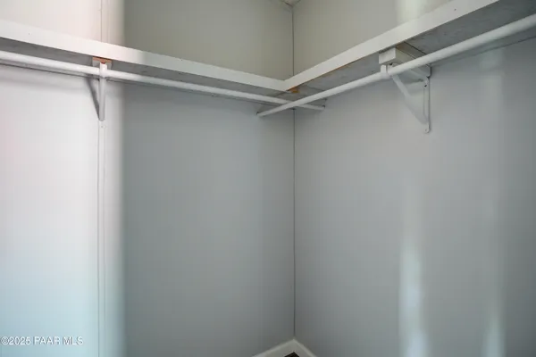 a view of an empty walk in closet
