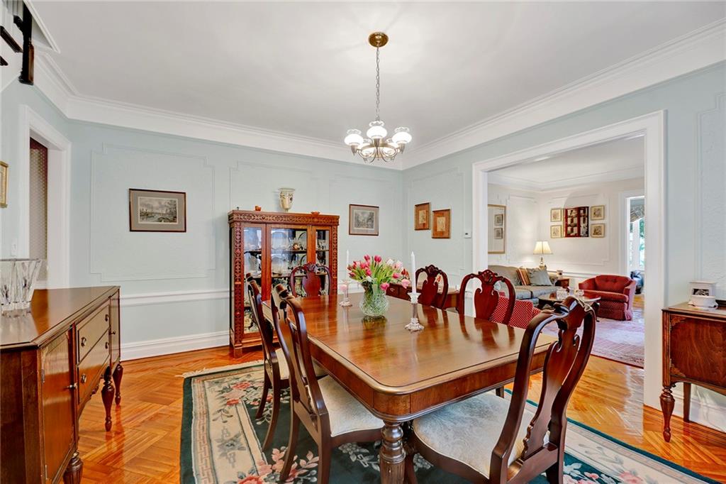 7607 Colonial Road Brooklyn, NY 11209 - Photo 11 of 35 a view of a dining room with furniture and chandelier