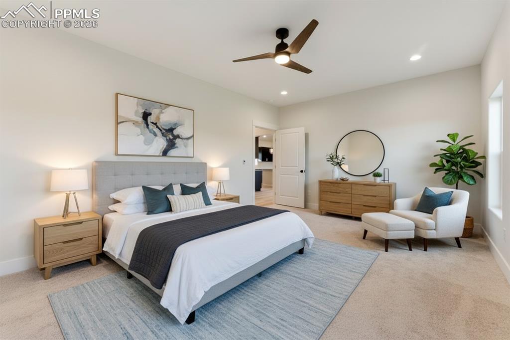 806 Keystone Loop Canon City, CO 81212 - Photo 11 of 39 a bedroom with a large bed and ceiling fan