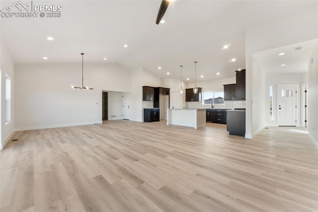 806 Keystone Loop Canon City, CO 81212 - Photo 18 of 39 an empty room with kitchen view and a window