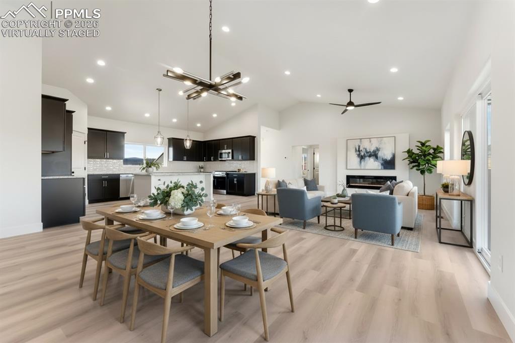 806 Keystone Loop Canon City, CO 81212 - Photo 2 of 39 a view of a dining room with furniture a kitchen and chandelier