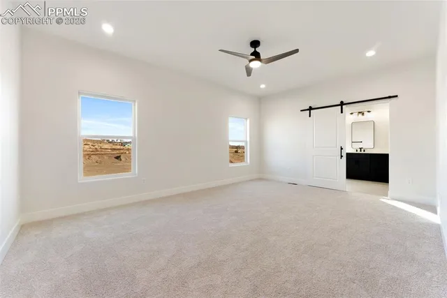 a view of empty room with windows