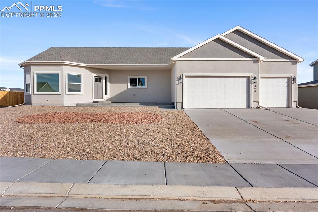 806 Keystone Loop Canon City, CO 81212 - Photo 38 of 39 a front view of a house with a yard and garage