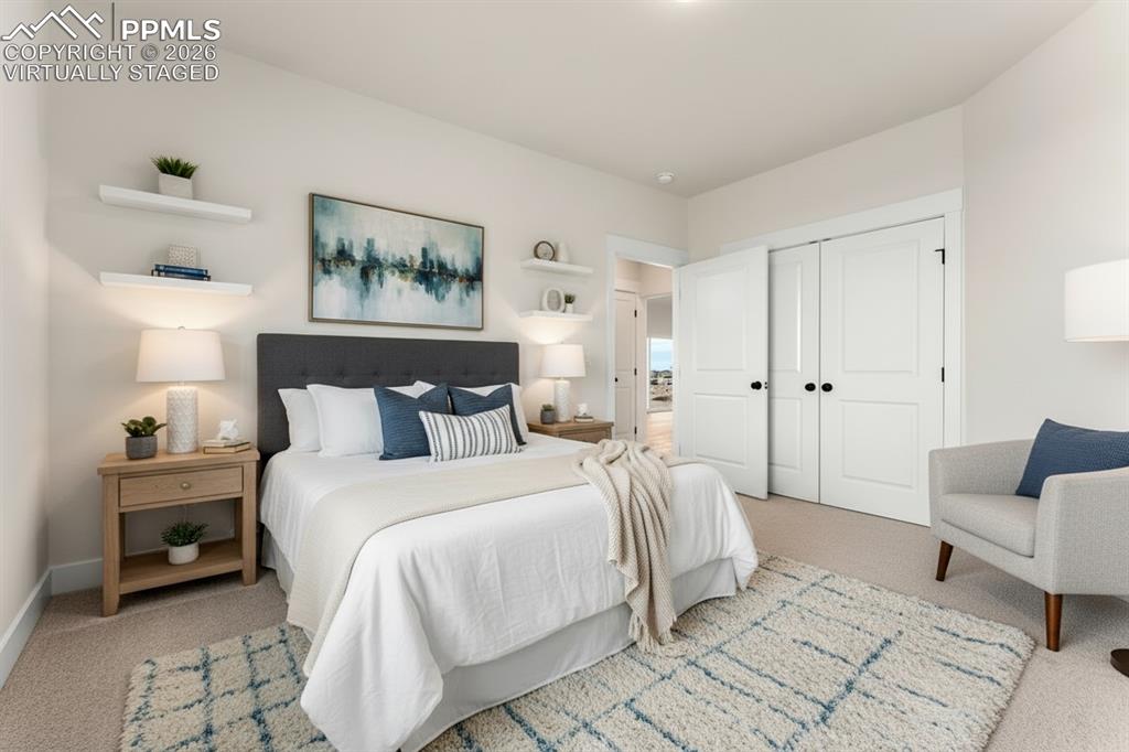 806 Keystone Loop Canon City, CO 81212 - Photo 9 of 39 a bedroom with a bed and a couch