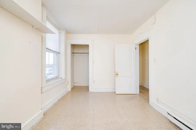 a view of hallway with rug