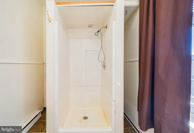 a white toilet sitting next to a bathroom sink