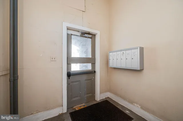 a view of a hallway with staircase