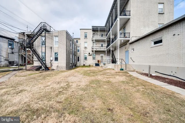 a front view of building with yard