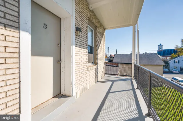 a kitchen with stainless steel appliances granite countertop a sink and a refrigerator