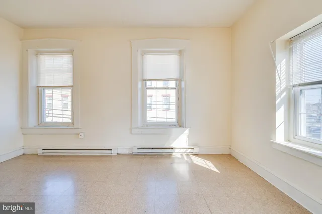 an empty room with windows