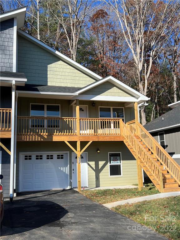 512 Sycamore Br Road Asheville, NC 28803 - Photo 1 of 1 a front view of a house with garage