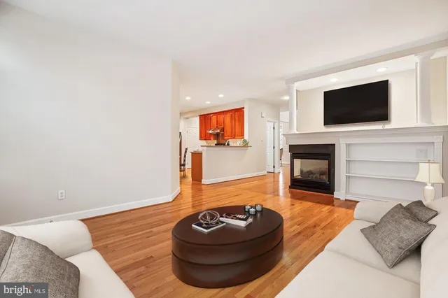 a kitchen with stainless steel appliances granite countertop sink stove top oven refrigerator and cabinets