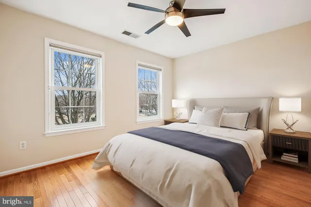 a bedroom with a bed and cabinets