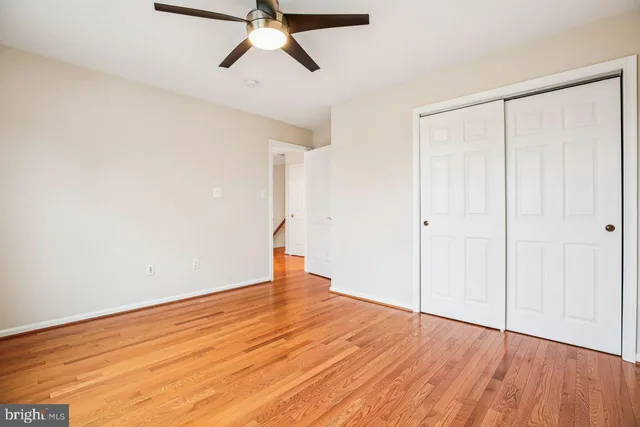 a bedroom with a bed and cabinets