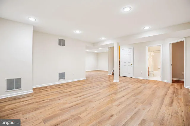 a view of a park with large trees