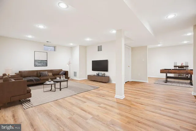 a view of a cafe with tables and chairs