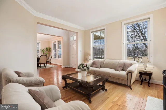 a dining room with furniture and wooden floor