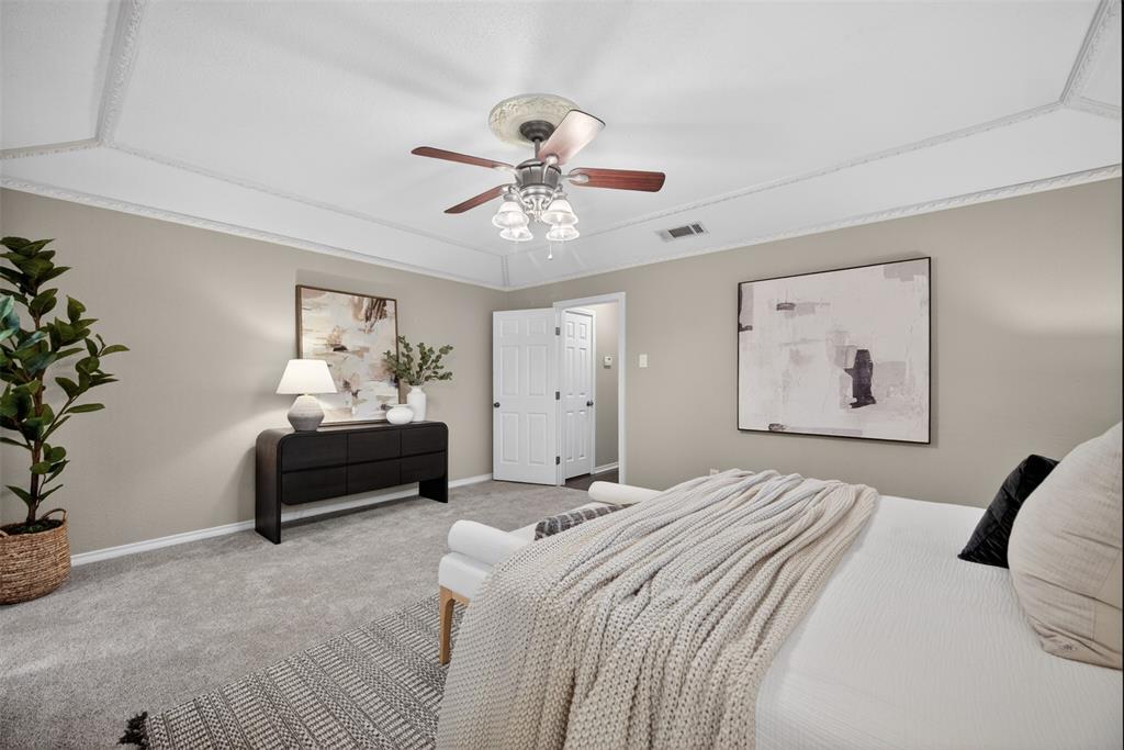 9660 Timberleaf Drive Dallas, TX 75243 - Photo 30 of 40 Tray ceiling with decorative molding and a ceiling fan with light fixture