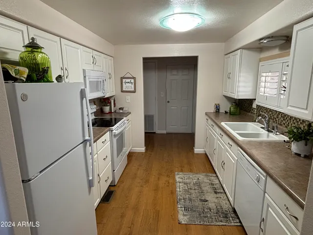 a bedroom with a bed and a mirror