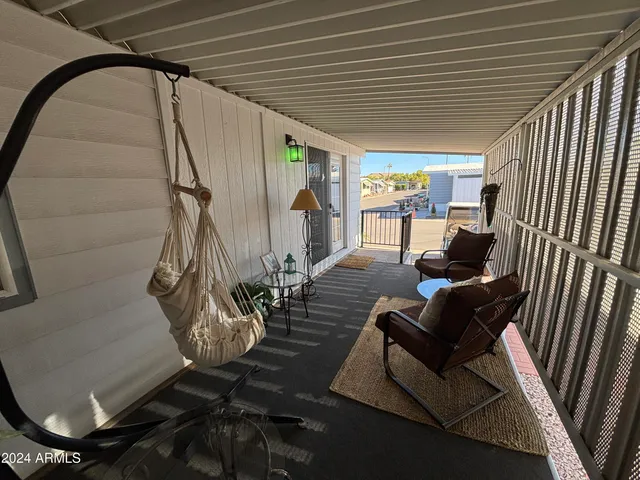 a view of a livingroom with furniture and staircase