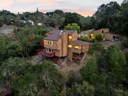 an aerial view of a house with a garden