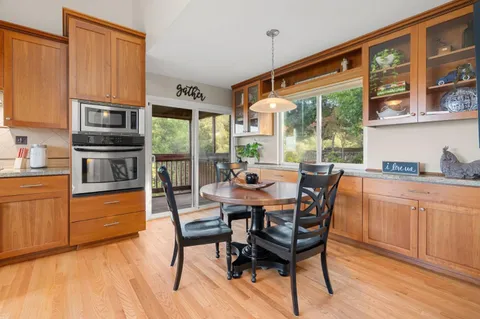 a view of a dining room with furniture window and outside view