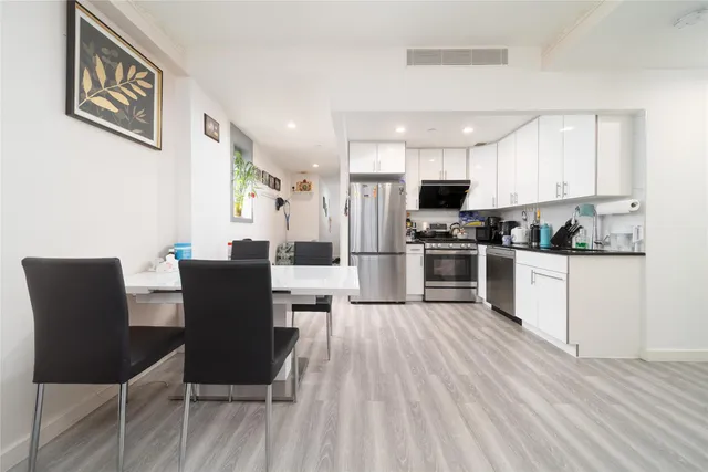 a view of kitchen with cabinets and stainless steel appliances