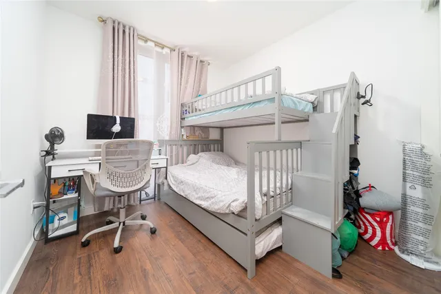 a bedroom with furniture and a book shelf