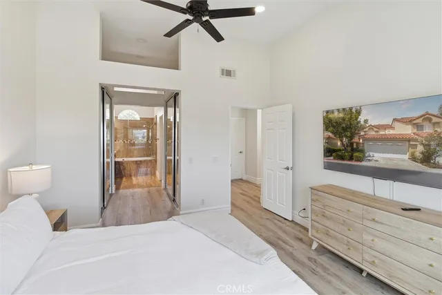 a bedroom with a bed and a dresser