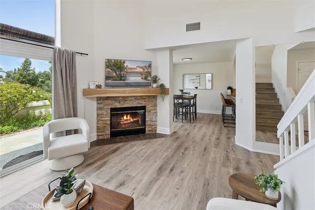 a living room with furniture and a fireplace