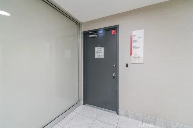 a living room with furniture a flat screen tv and a window