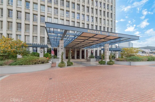 front view of a building with a garden