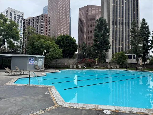 a view of a chair and table in the patio with a house