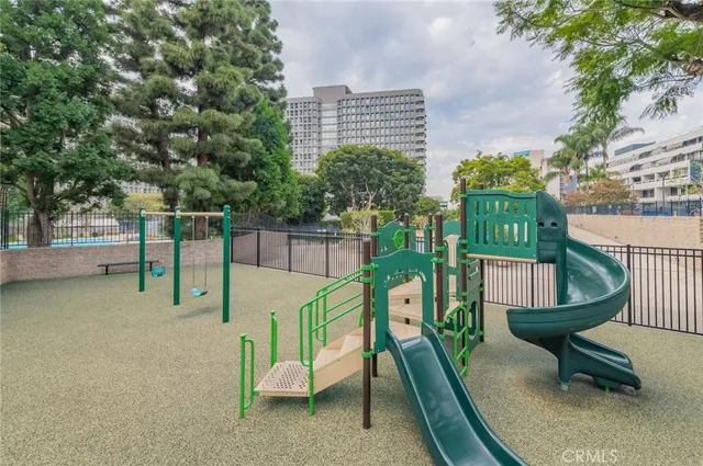 a view of a gate and trees