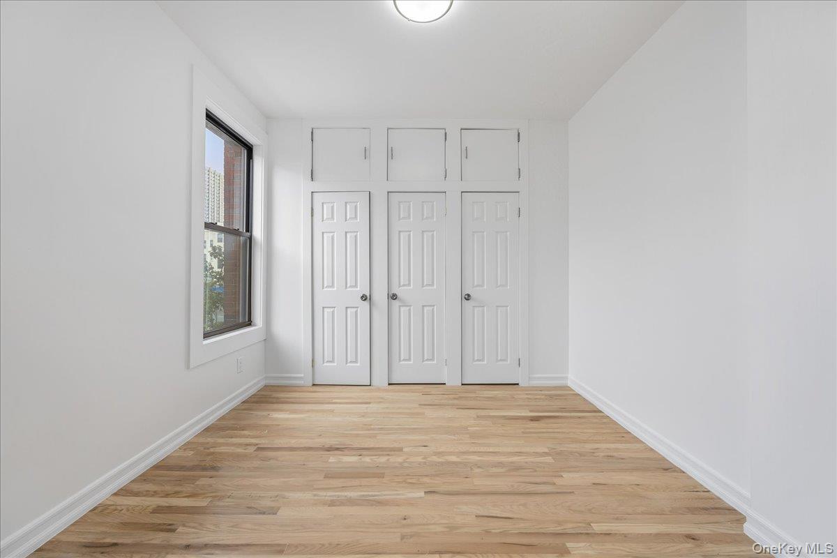 160 Wadsworth Avenue, Unit 302 Manhattan, NY 10033 - Photo 11 of 21 a view of a livingroom with wooden floor