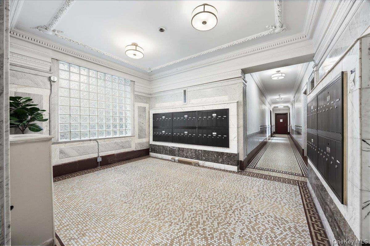 160 Wadsworth Avenue, Unit 302 Manhattan, NY 10033 - Photo 19 of 21 a view of an empty room with a fireplace and a large window