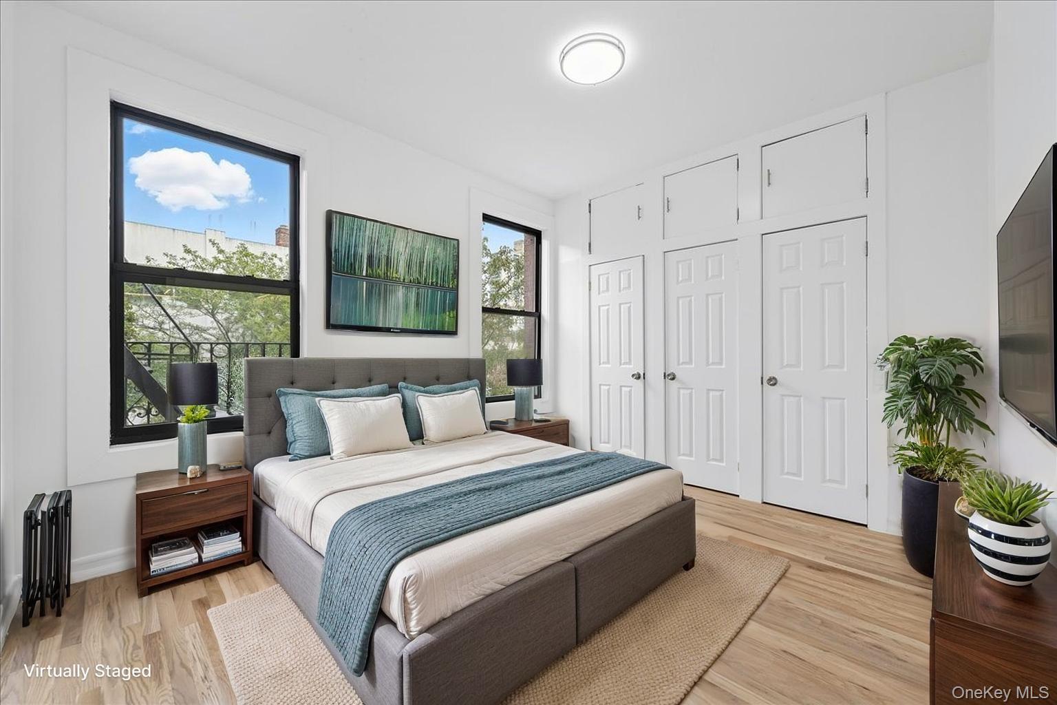 160 Wadsworth Avenue, Unit 302 Manhattan, NY 10033 - Photo 2 of 21 a bedroom with a bed potted plant with the view of bathroom