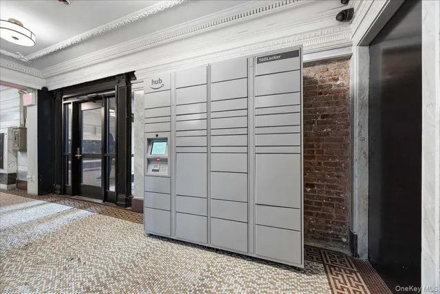 a view of an empty room with a fireplace and a large window
