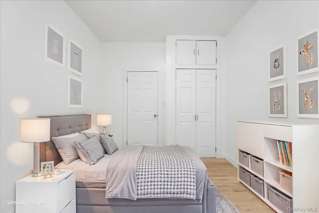 a bedroom with a bed and a book shelf