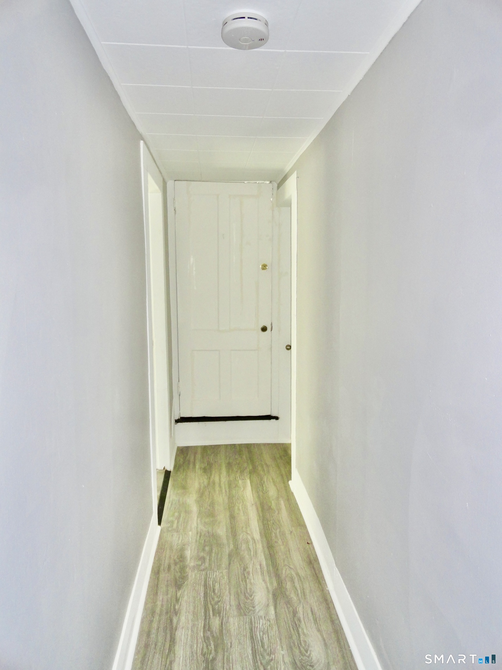 830 Main Street Winsted, CT 06098 - Photo 11 of 17 a view of hallway with wooden floor