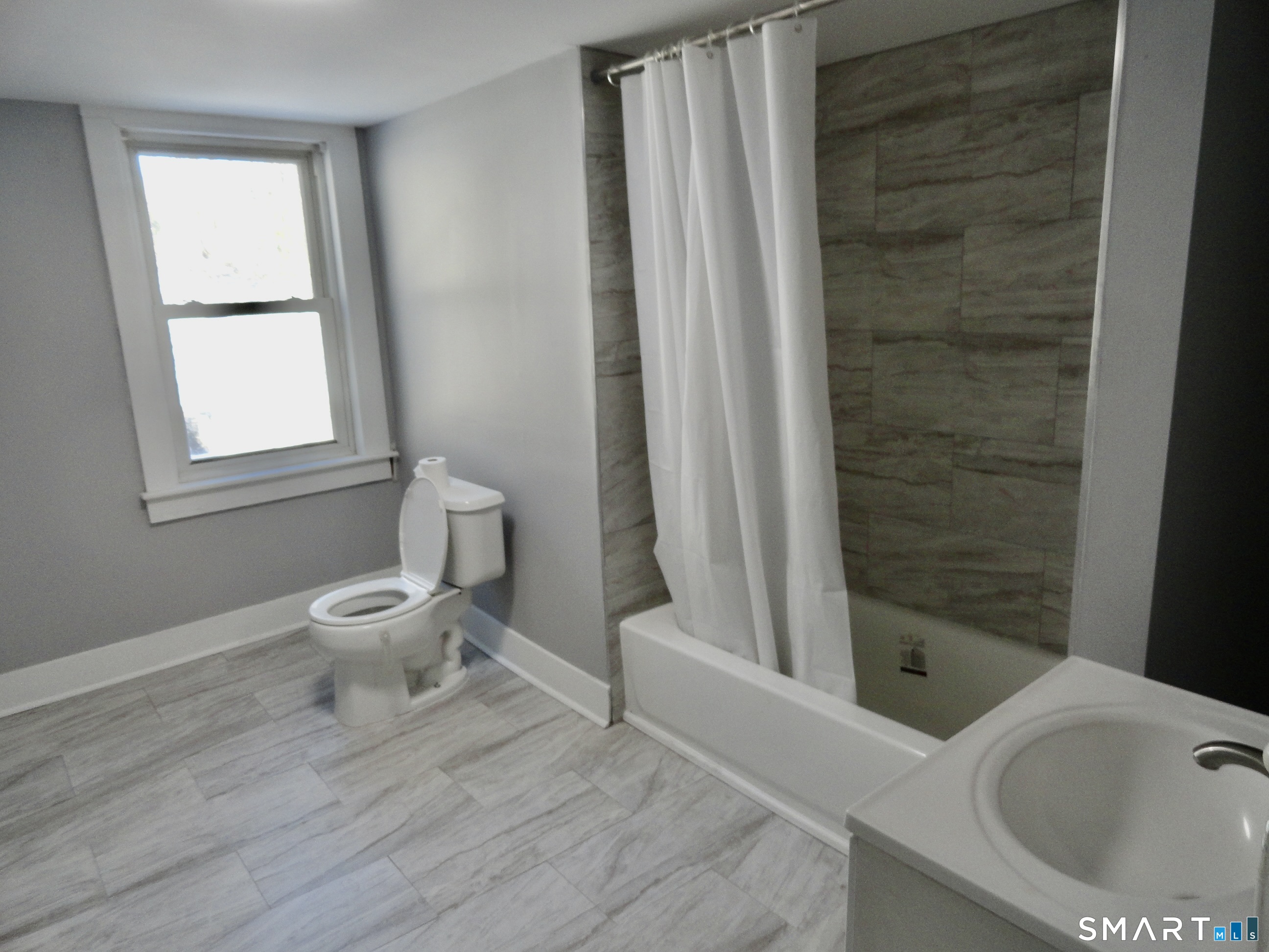 830 Main Street Winsted, CT 06098 - Photo 8 of 17 a bathroom with a sink and a toilet