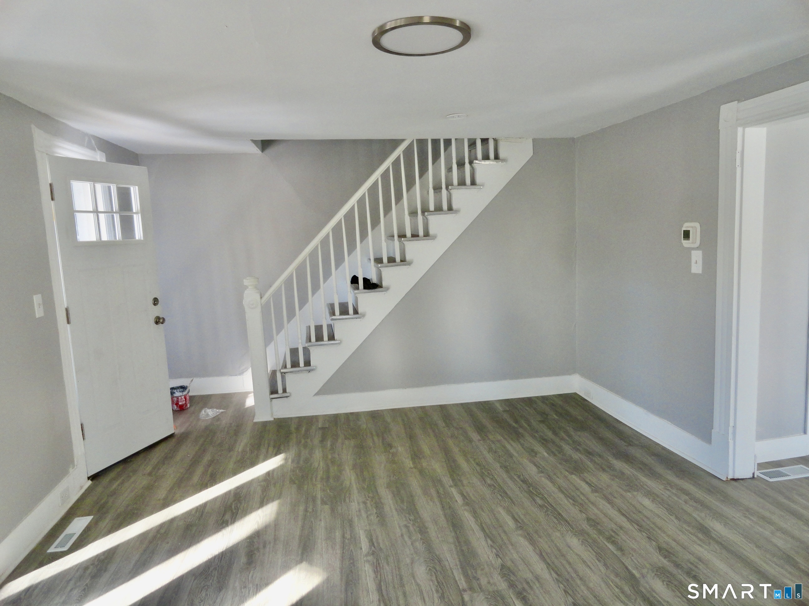 830 Main Street Winsted, CT 06098 - Photo 9 of 17 a view of entryway and hall with wooden floor