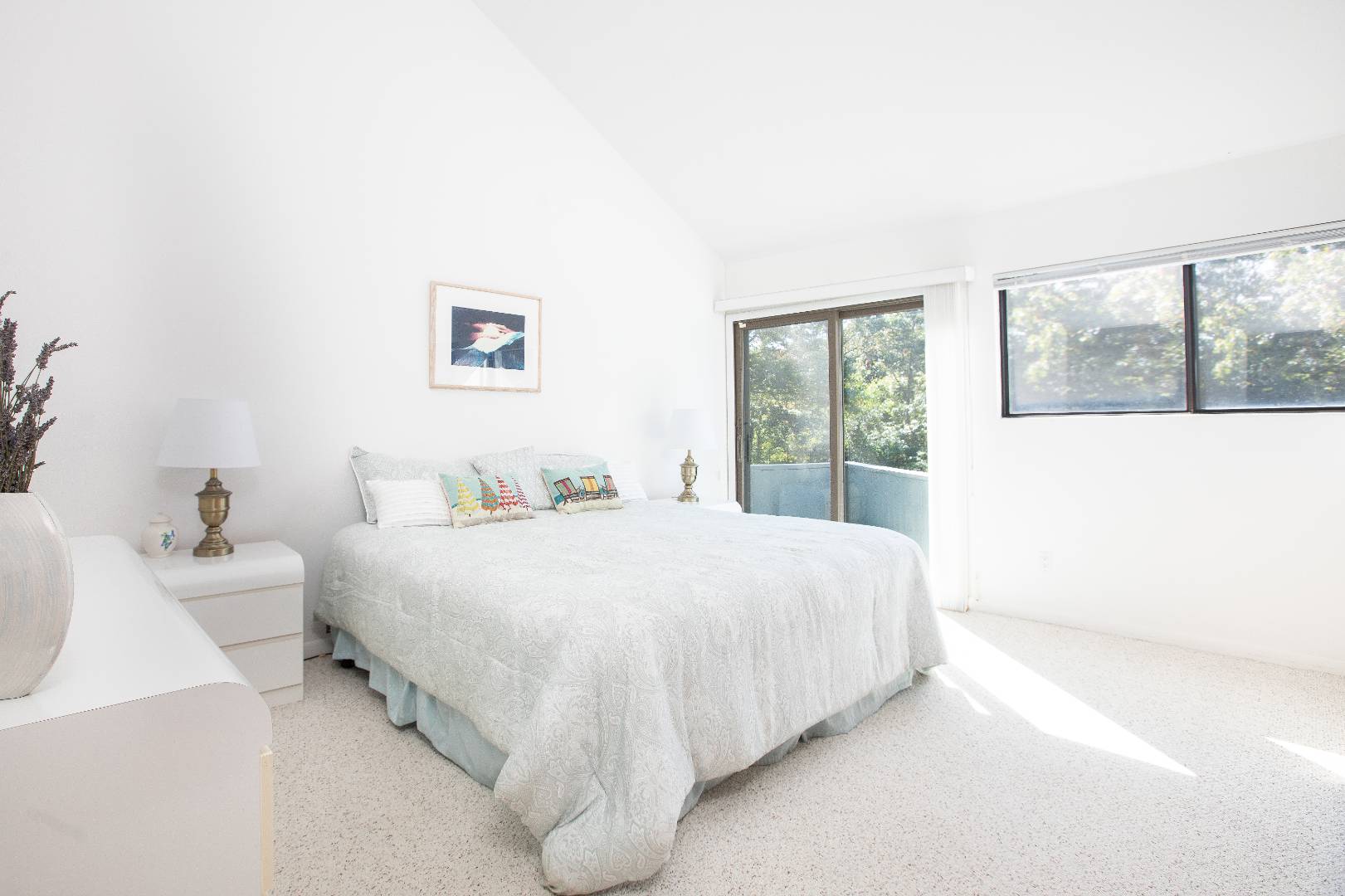 15 North Quarter Road Westhampton, NY 11977 - Photo 12 of 20 a bedroom with a bed and a large window