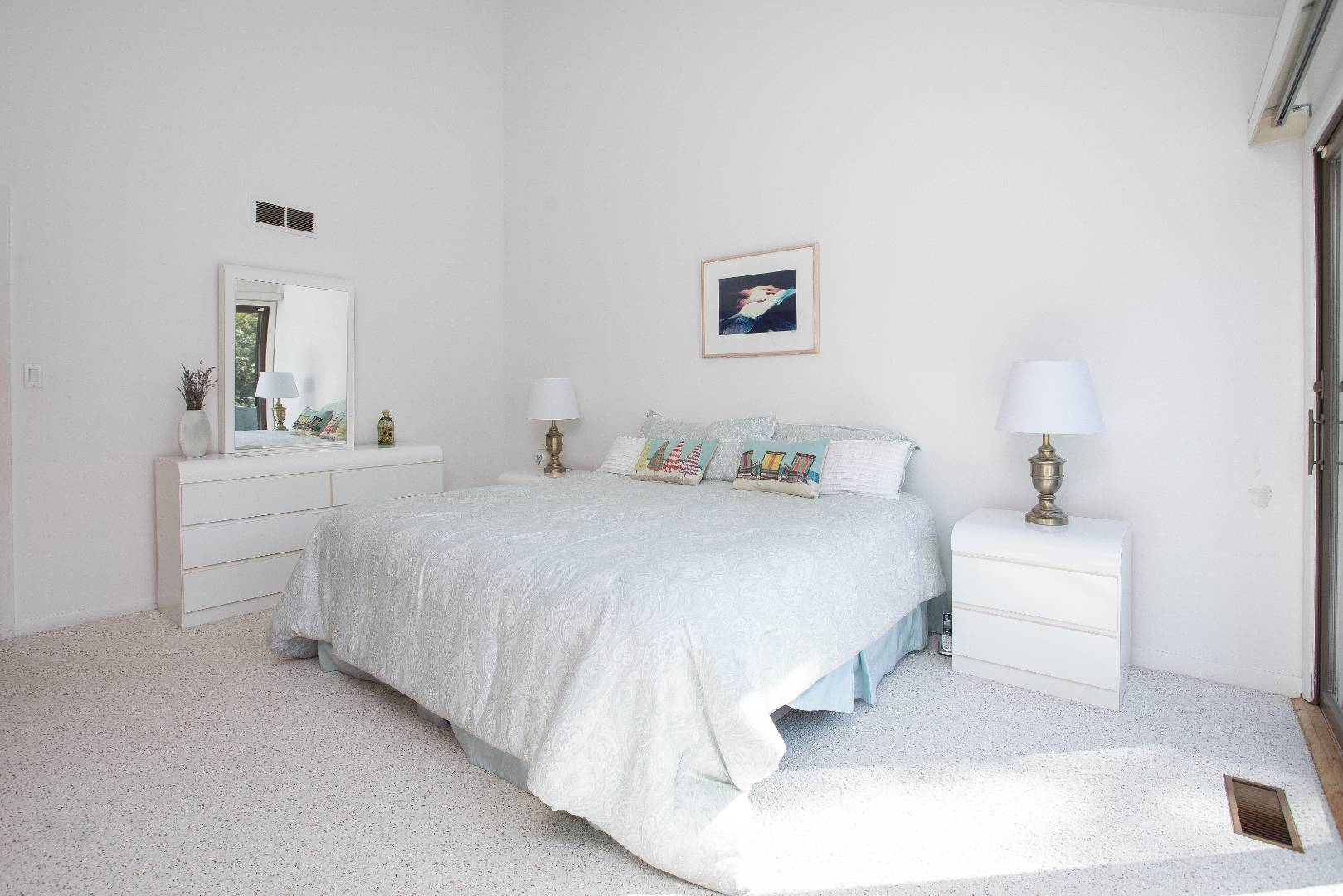 15 North Quarter Road Westhampton, NY 11977 - Photo 13 of 20 a bedroom with a white bed and a couch