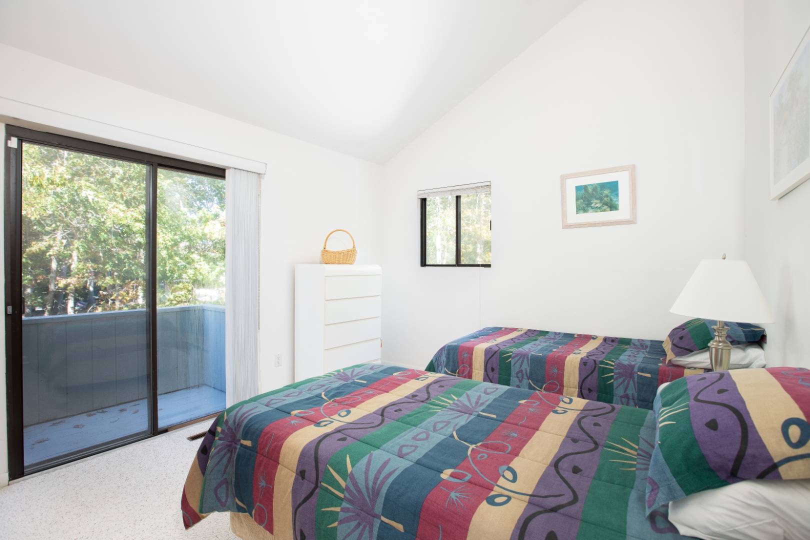 15 North Quarter Road Westhampton, NY 11977 - Photo 17 of 20 a bedroom with a bed and glass window