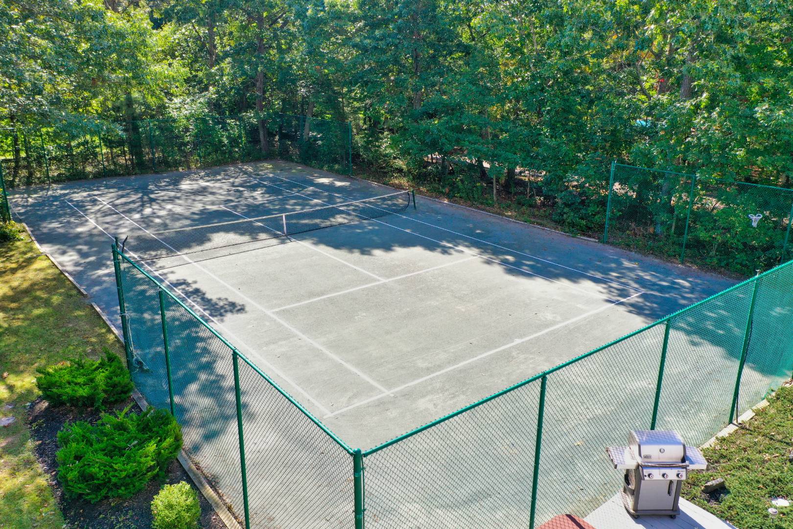 15 North Quarter Road Westhampton, NY 11977 - Photo 3 of 20 a view of a backyard that has plants and a tree