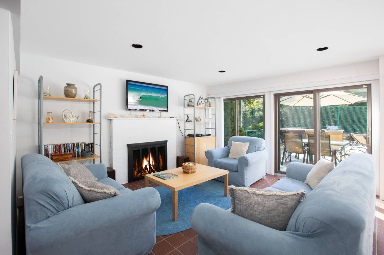 15 North Quarter Road Westhampton, NY 11977 - Photo 6 of 20 a living room with furniture large window and fireplace